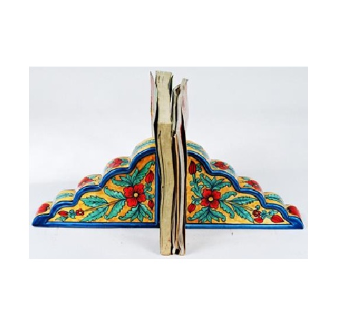 Ceramic Decorative bookends with a book placed between them Bookends are used to keep books upright on a shelf or desk they come in various materials, including metal, wood, stone, and fabric. Bookends can be functional and decorative, adding to the aesthetic of a space the term "bookend" #9081